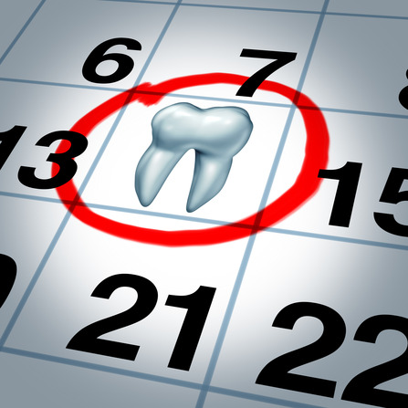 Dentist appointment and dental check up health care concept as a month calendar with a tooth circled