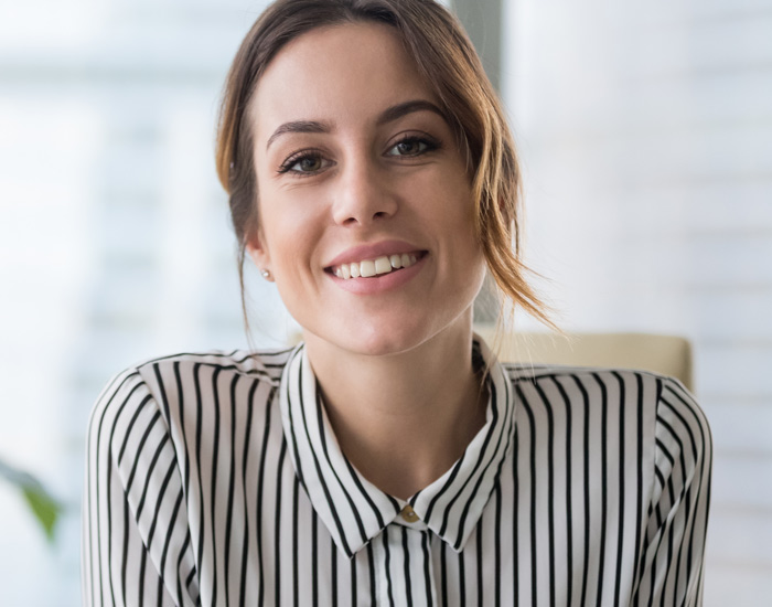 woman in striped shirt smiling