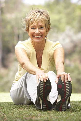 Senior age women sitting on ground