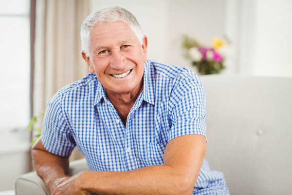 Senior man looking at camera and smiling