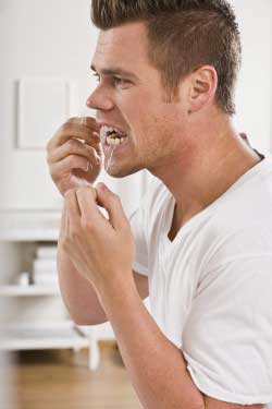 A boy cleaning his teeth